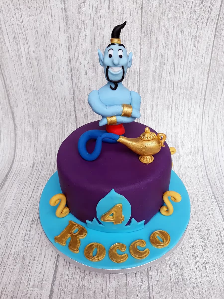 Aladdin themed 4th birthday cake with genie and magic lamp in purple and blue