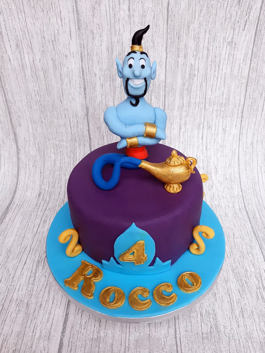 Aladdin themed 4th birthday cake with genie and magic lamp in purple and blue