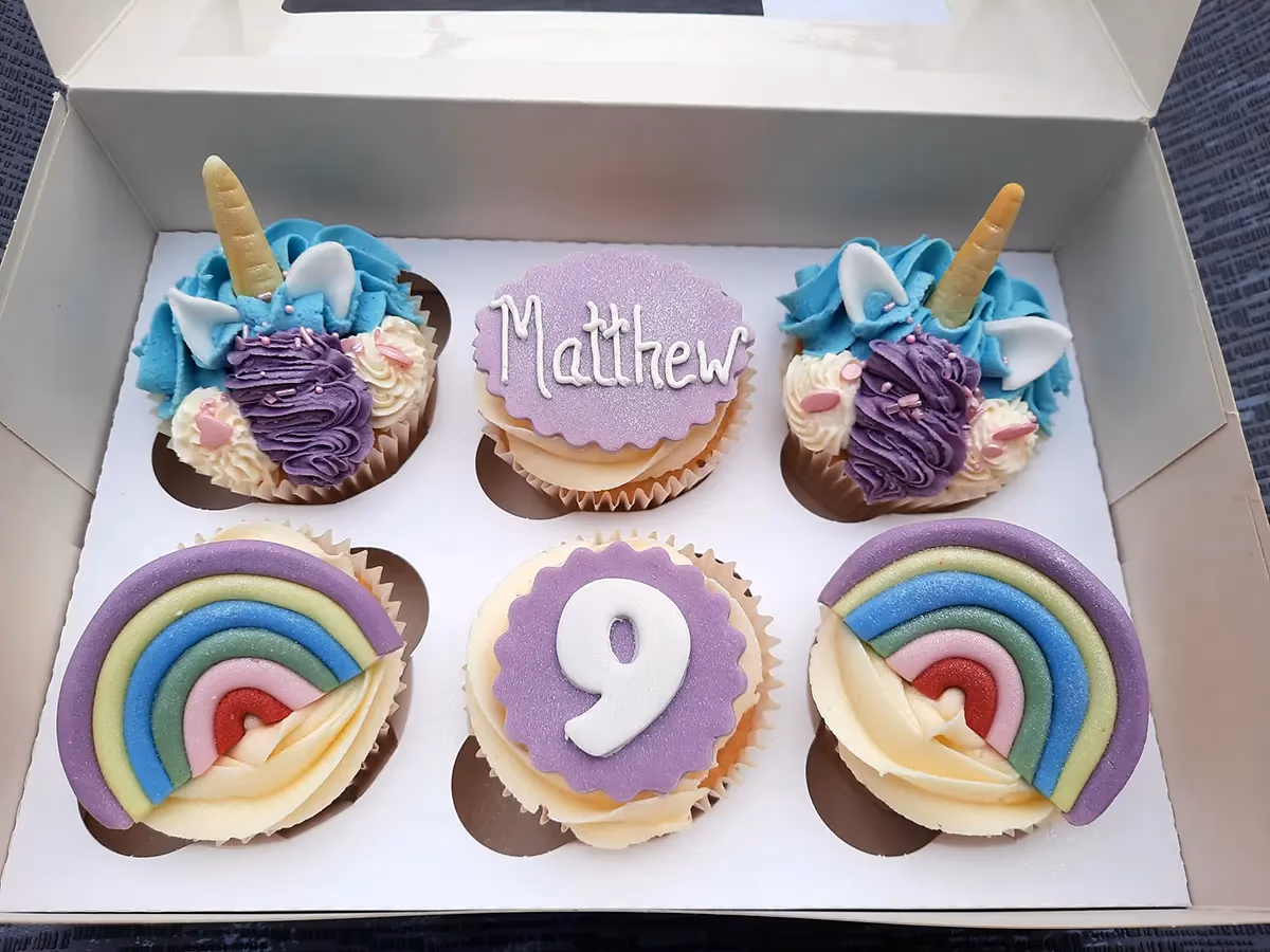 Unicorn and rainbow birthday cupcakes by Thelwall Bakehouse