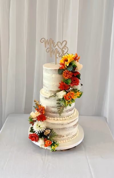 Bespoke wedding cake - three-tier naked cake with autumn flowers